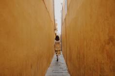 photo-of-woman-walk-through-pathway-1093946